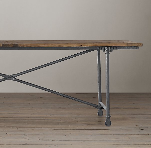 Cast metal with elmwood create a magnificent dining room table