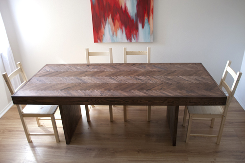 A beautiful dining room table created from an old table and various other materials. 